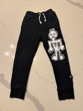 nununu Black Joggers with White Graphic Figure